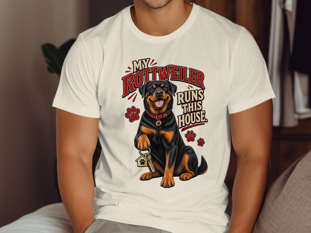Rottweiler with keys and text "My Rottweiler Runs This House" on a t-shirt.