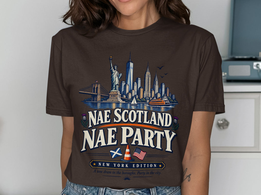 Brown t-shirt with New York City skyline, "Nae Scotland Nae Party" text, and flags.