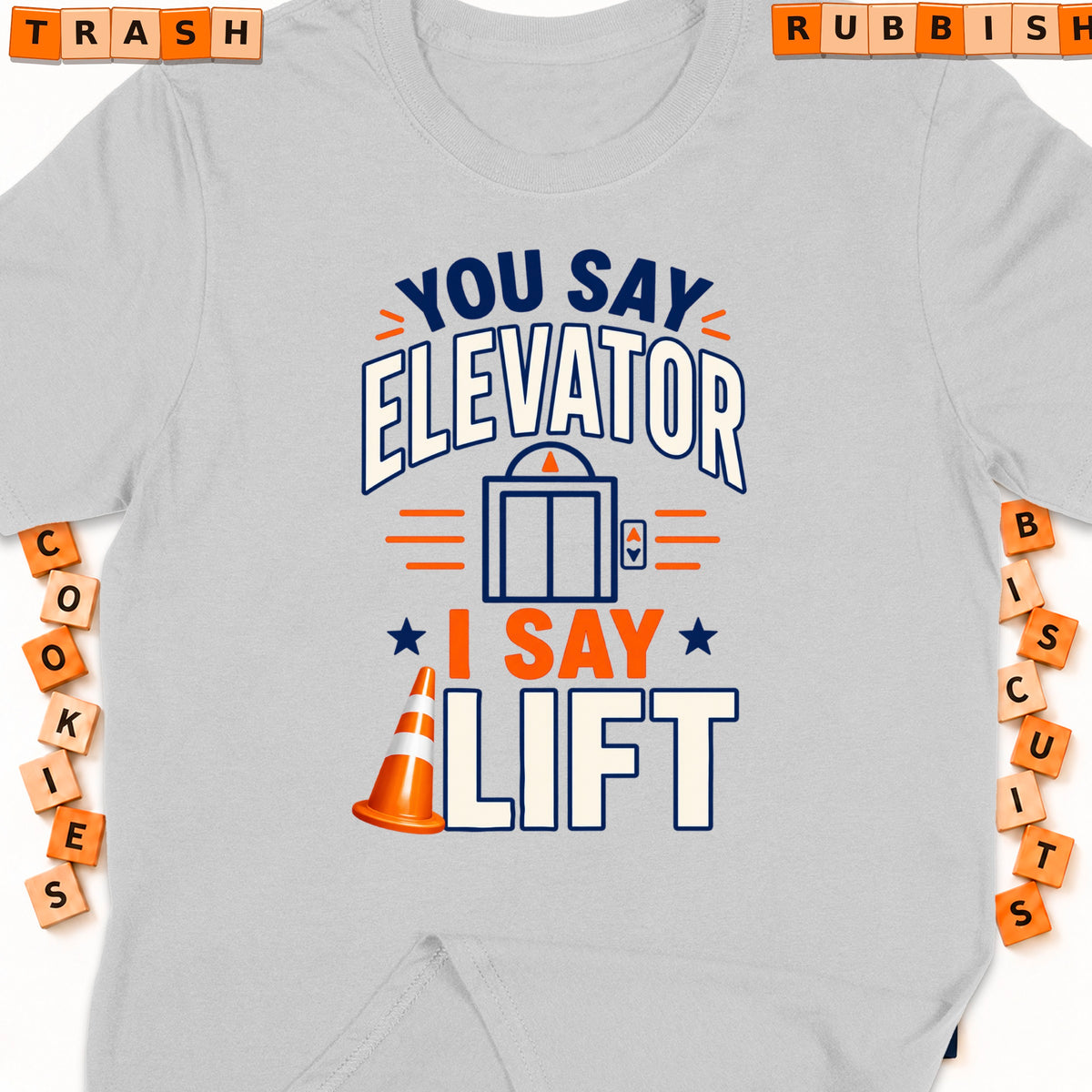 Gray t-shirt with "You say elevator, I say lift" graphic and traffic cone.