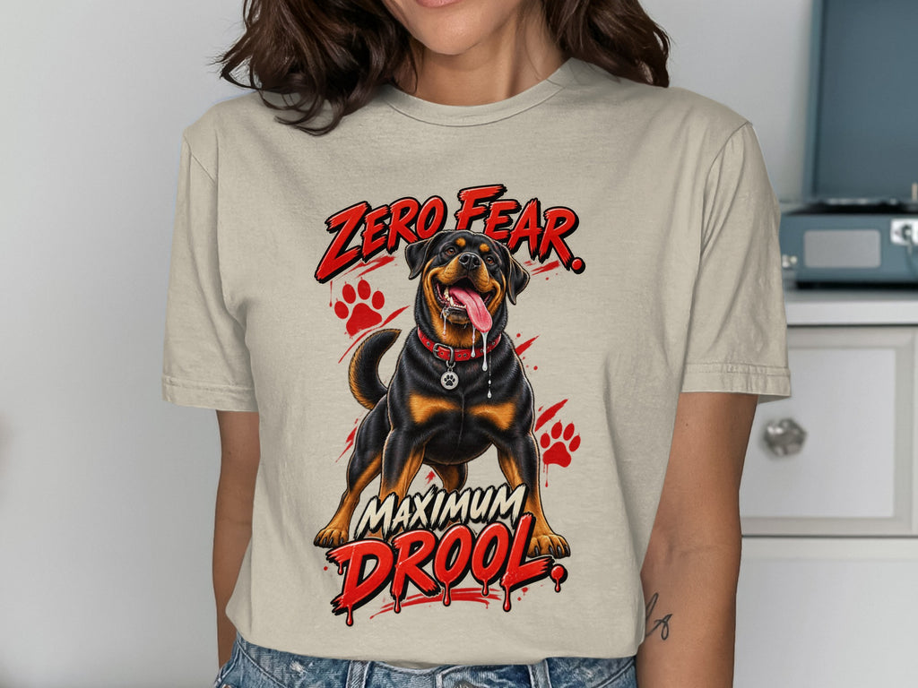 Rottweiler on t-shirt with "Zero Fear Maximum Drool" text and paw prints.