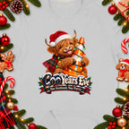 Highland cow wearing Santa hat holding traffic cone with Christmas lights, "CooYears Eve" text.
