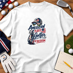 White t-shirt with patriotic golf graphic reading American by birth golfer by bad decision surrounded by golf accessories.