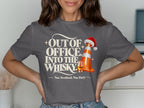 T-shirt graphic with "Out of Office. Into the Whisky." and a traffic cone with Santa hat.