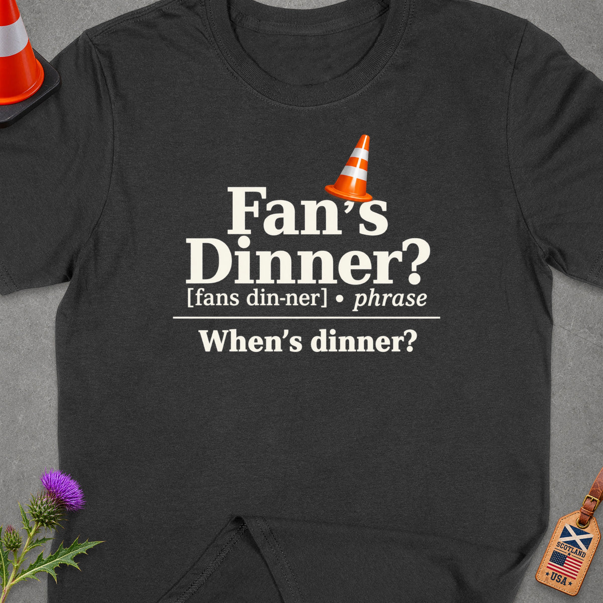 Dark t-shirt with "Fan's Dinner? When's dinner?" and a traffic cone graphic.