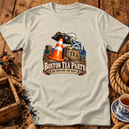 Off-white crewneck t-shirt featuring a colorful graphic of a traffic cone wearing a pirate hat, with text reading BOSTON TEA PARTY NAE SCOTLAND, NAE PARTY.
