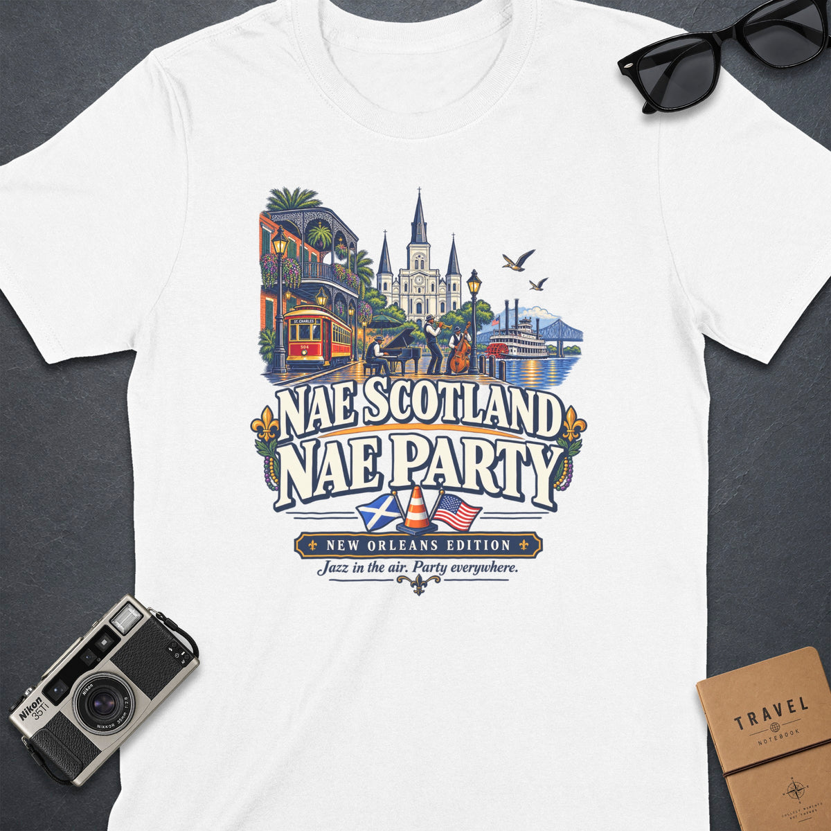 T-shirt with New Orleans scene, jazz band, streetcar, and text "Nae Scotland Nae Party".
