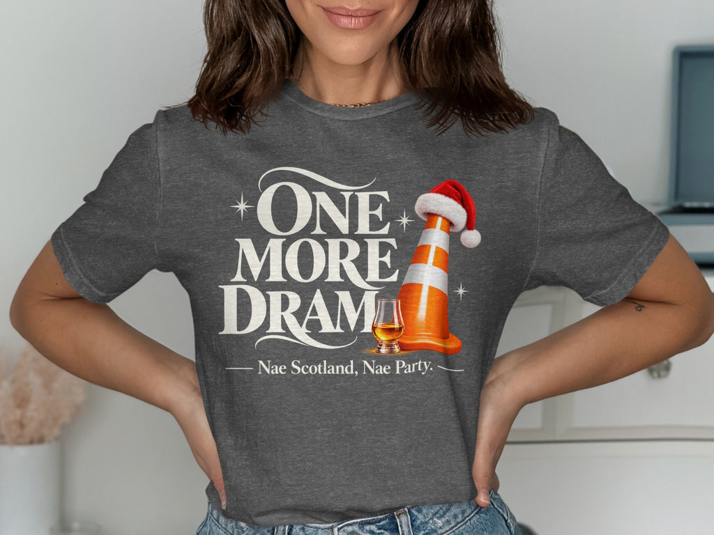 Dark grey t-shirt with "One More Dram" text, a traffic cone with a Santa hat, and a glass of whisky.
