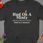 Dark t-shirt with "Hud On A Minty" text and traffic cone graphic.