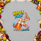 Cartoon rabbit with traffic cone and Easter eggs, "Hop It, Pal!" and "Nae Scotland, Nae Party." text.