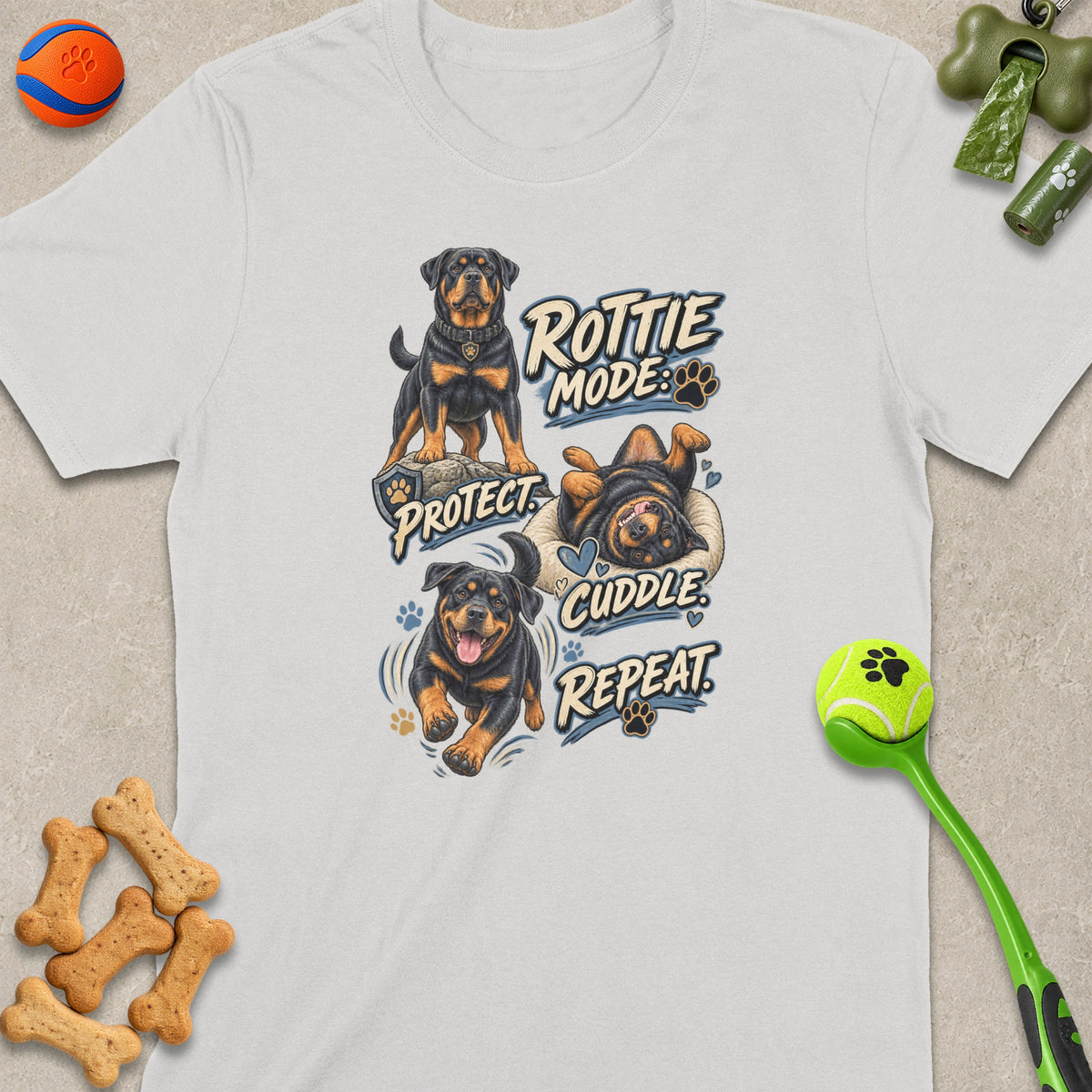 White t-shirt with Rottie Mode: Protect, Cuddle, Repeat design featuring three Rottweilers.