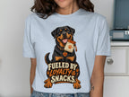 Rottweiler with a treat bag and text "Fueled by Loyalty & Snacks."