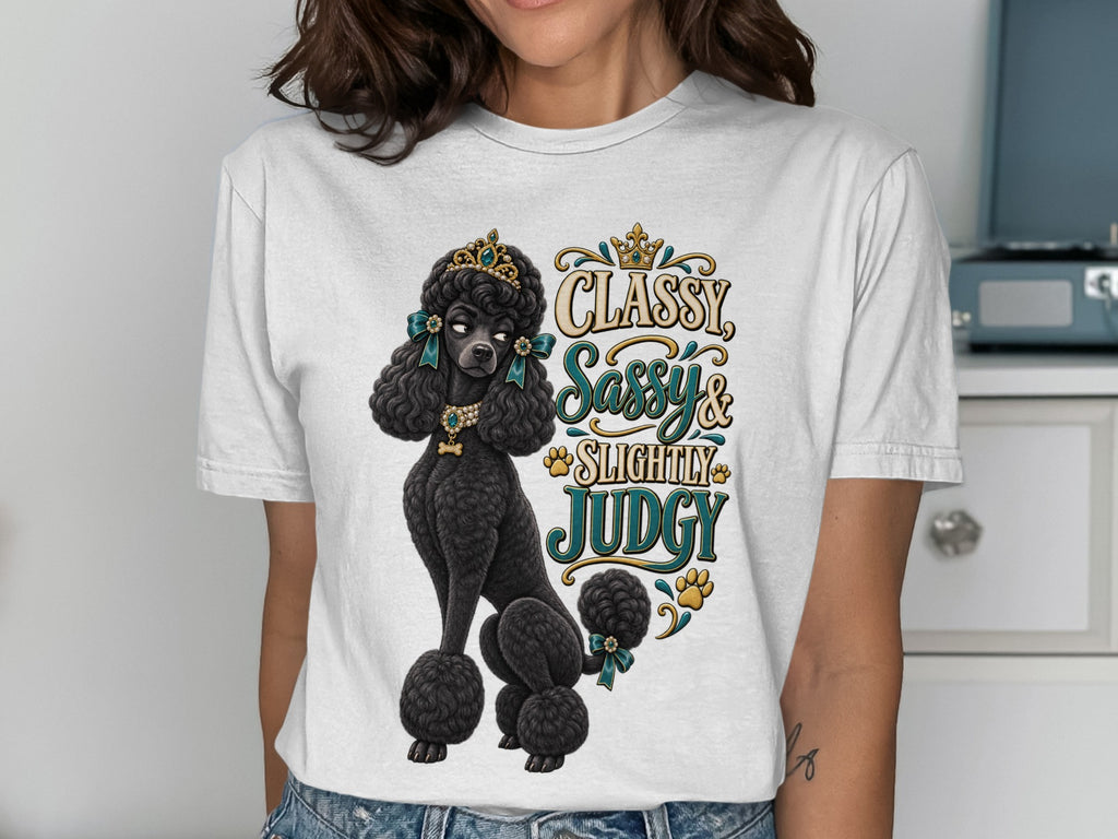 White t-shirt graphic with a black poodle wearing a crown and jewelry, with text "Classy Sassy & Slightly Judgy".