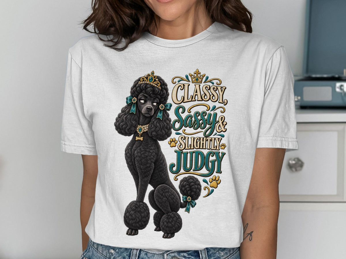 White t-shirt graphic with a black poodle wearing a crown and jewelry, with text "Classy Sassy & Slightly Judgy".