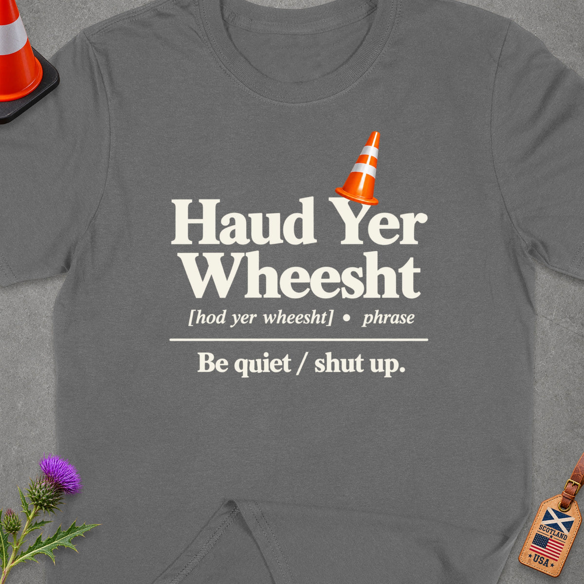 Grey t-shirt with "Haud Yer Wheesht" and its definition.