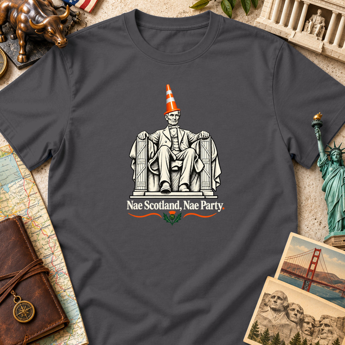 Dark gray t-shirt featuring a graphic of Abraham Lincoln wearing a traffic cone with the text Nae Scotland, Nae Party.
