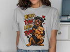Rottweiler dog holding a teddy bear with text "Built Like A Tank Loves Like A Teddy".