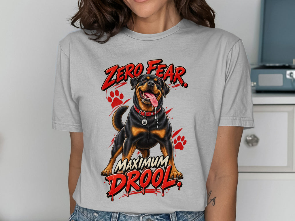 Rottweiler with "Zero Fear Maximum Drool" text and paw prints on grey t-shirt.