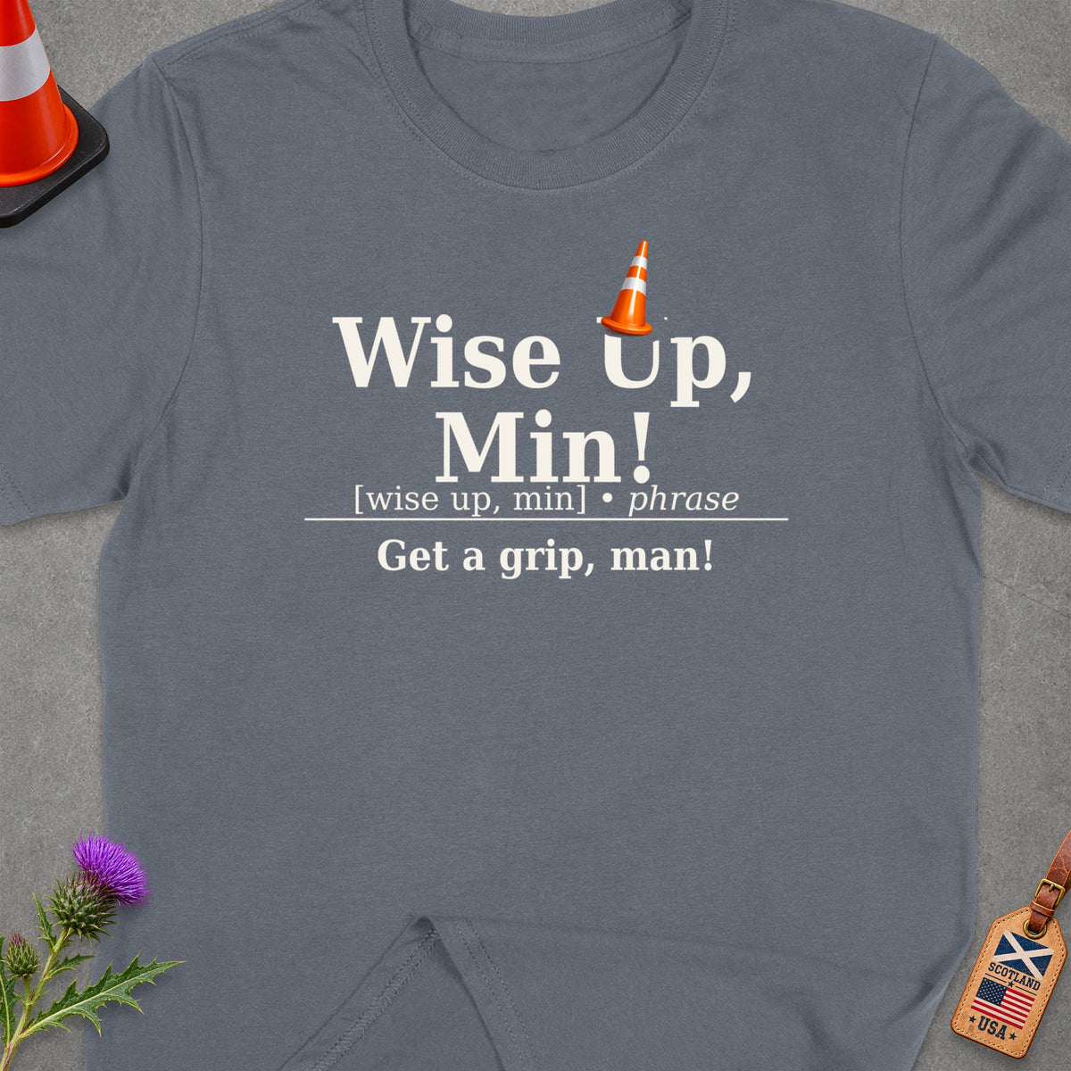 Grey t-shirt with "Wise Up, Min! Get a grip, man!" text and traffic cone graphic.