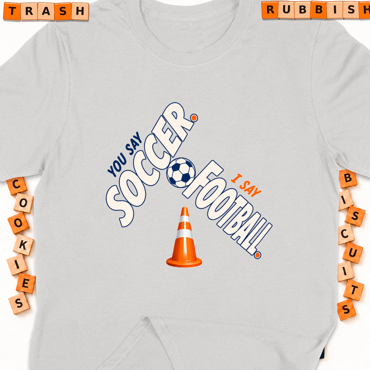 Grey t-shirt with "You say soccer, I say football" and a soccer ball.