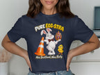 White bunny with a traffic cone, ornate egg, and chick, with text "PURE EGG-STRA Nae Scotland, Nae Party."