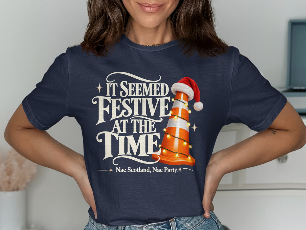 Dark blue t-shirt with "It Seemed Festive At The Time" and a traffic cone.