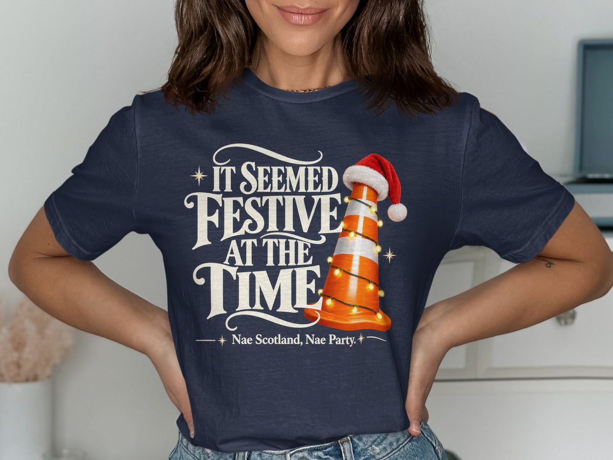 Dark blue t-shirt with "It Seemed Festive At The Time" and a traffic cone.