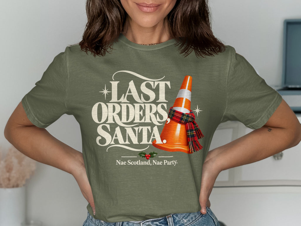 Green t-shirt with "Last Orders, Santa" and a traffic cone wearing a scarf.