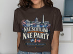 Brown t-shirt with Washington DC landmarks and "Nae Scotland Nae Party" text.