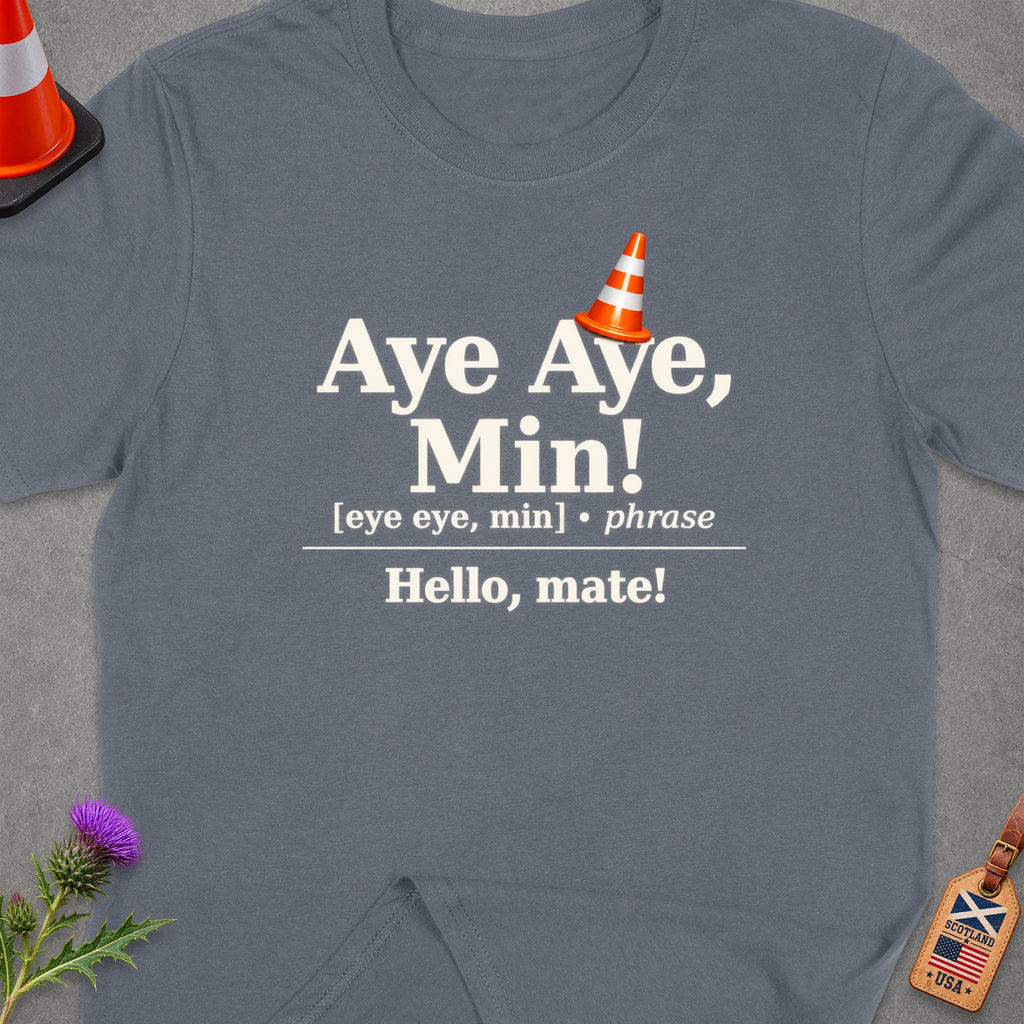 Grey t-shirt with text "Aye Aye, Min! Hello, mate!" and a traffic cone.