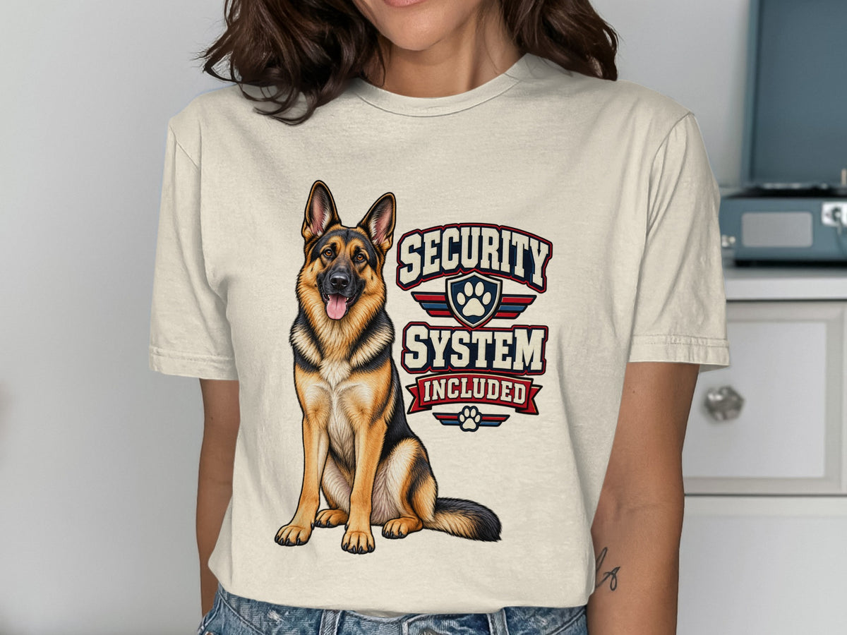 German Shepherd and "Security System Included" text on a cream t-shirt.