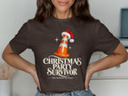 Dark brown t-shirt with "Christmas Party Survivor" and "Nae Scotland, Nae Party" text.