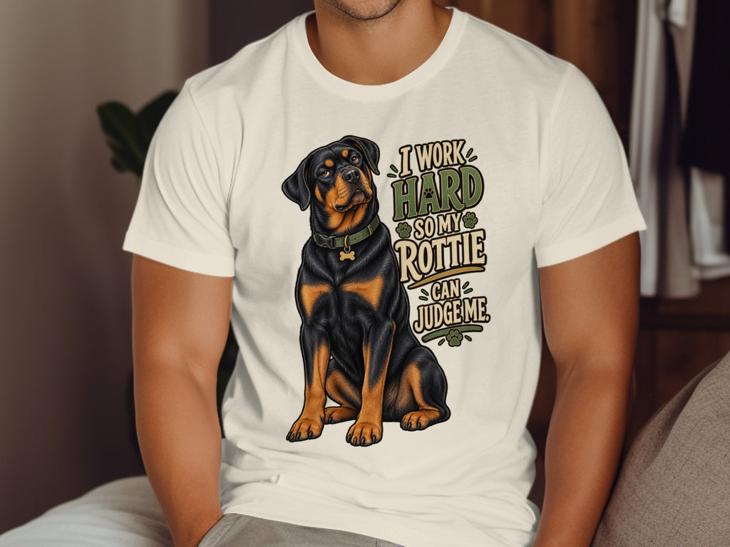 White t-shirt with a Rottweiler and text "I work hard so my Rottie can judge me."