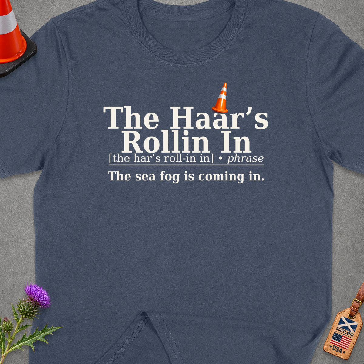 Blue t-shirt with "The Haar's Rollin In" and "The sea fog is coming in." text.