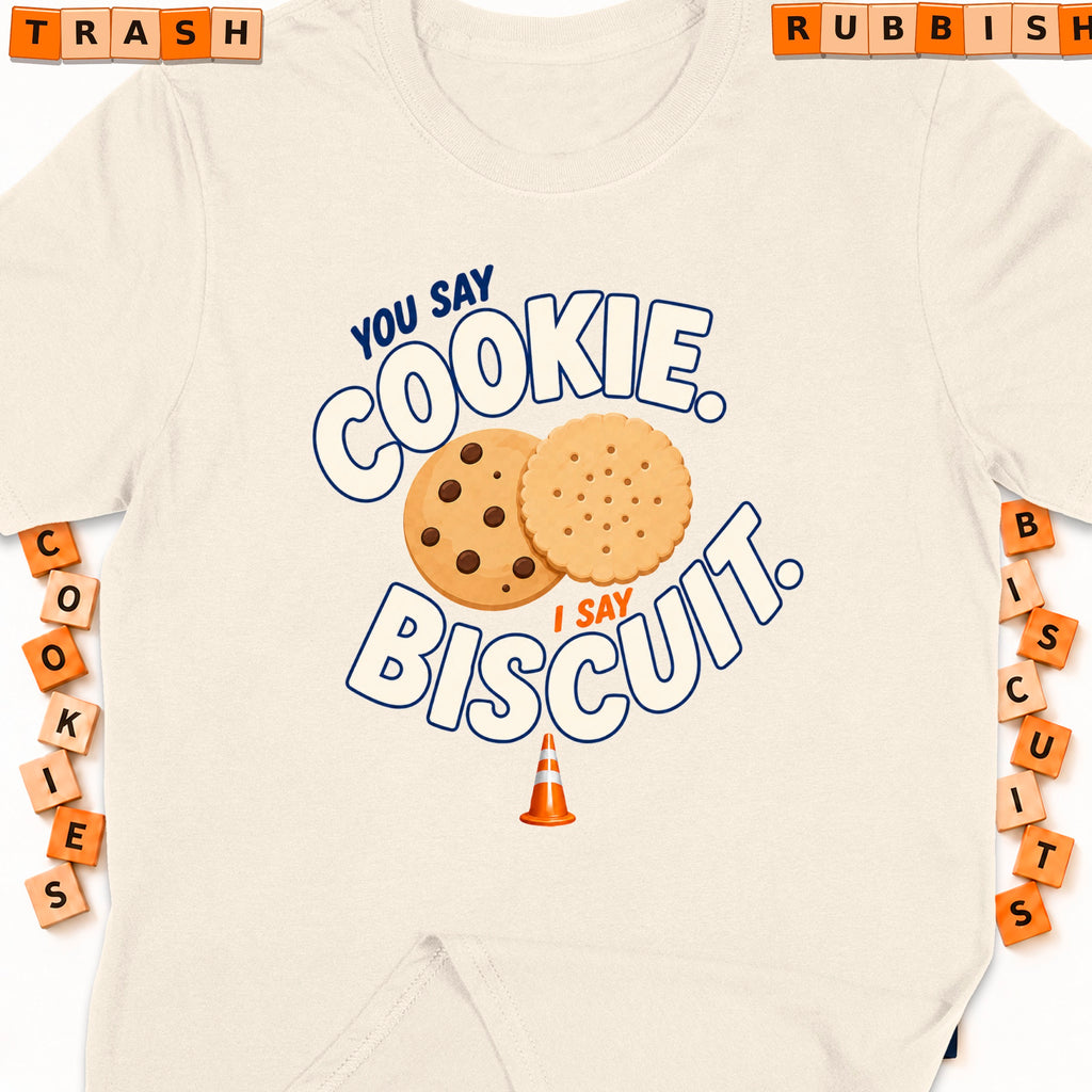 Cream t-shirt with graphic "You say cookie, I say biscuit" and cookies.