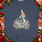Nessie Noel graphic with text "Nae Scotland, Nae Party." on a navy shirt.