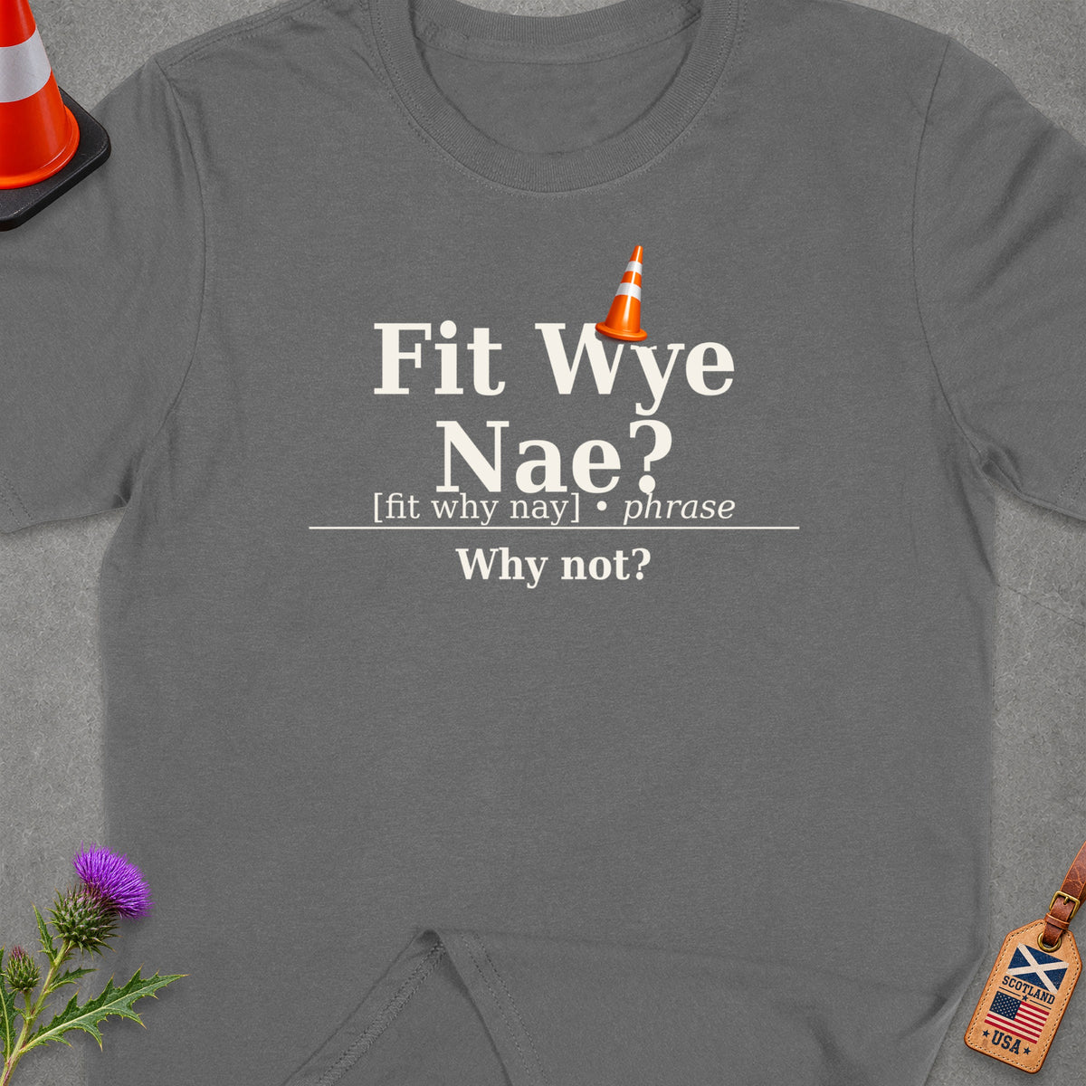 Grey t-shirt with "Fit Wye Nae? Why not?" and a traffic cone graphic.
