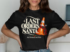 Black t-shirt with "Last Orders, Santa" and a traffic cone wearing a scarf.