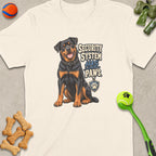 Rottweiler illustration on cream shirt with text "SECURITY SYSTEM HAS PAWS"