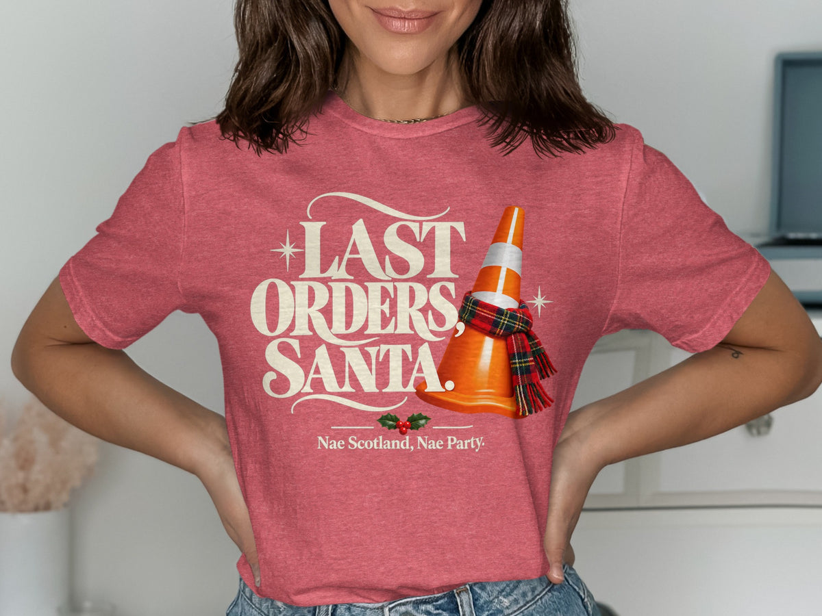 Red t-shirt with "LAST ORDERS, SANTA." text, orange cone with scarf, and holly.