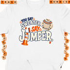 White t-shirt with text "You say sweater, I say jumper" and a knit sweater graphic.