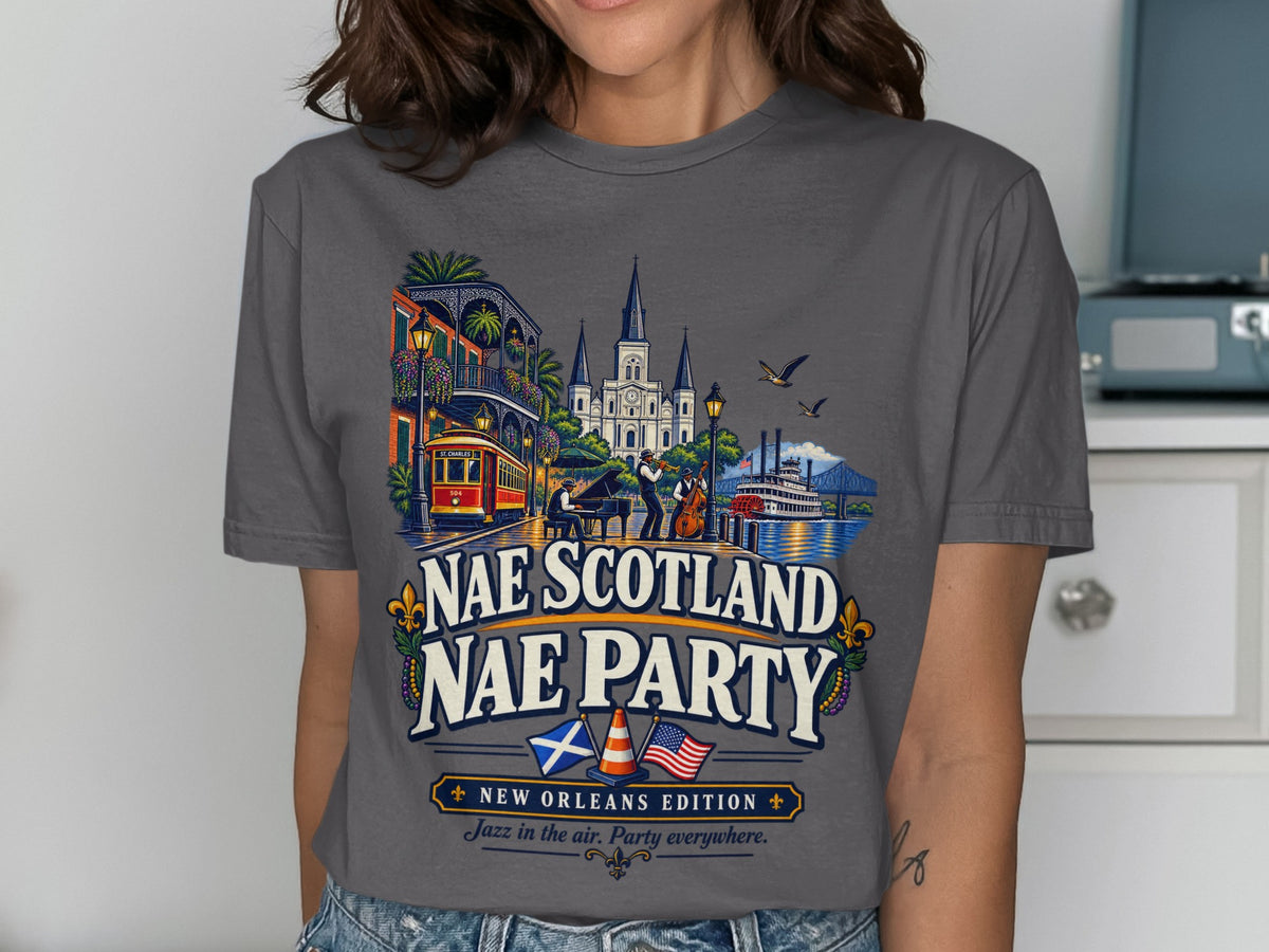 T-shirt with New Orleans scene, streetcar, jazz band, and "Nae Scotland Nae Party" text.