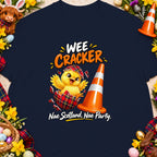 Chick hatching from tartan egg beside traffic cone with text "Wee Cracker" and "Nae Scotland, Nae Party."
