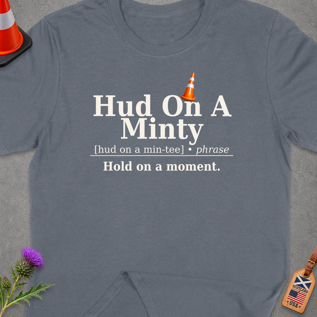 Grey t-shirt with "Hud On A Minty" and "Hold on a moment." text.