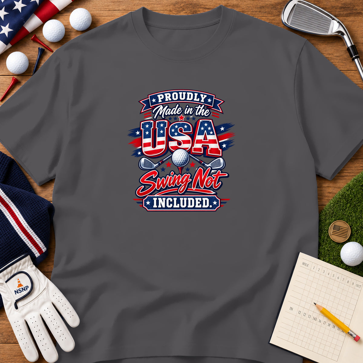 Dark gray t-shirt with patriotic golf graphic featuring the text Proudly Made in the USA.