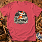 A coral pink t-shirt displays a graphic featuring a traffic cone amidst a historical Boston Tea Party scene.