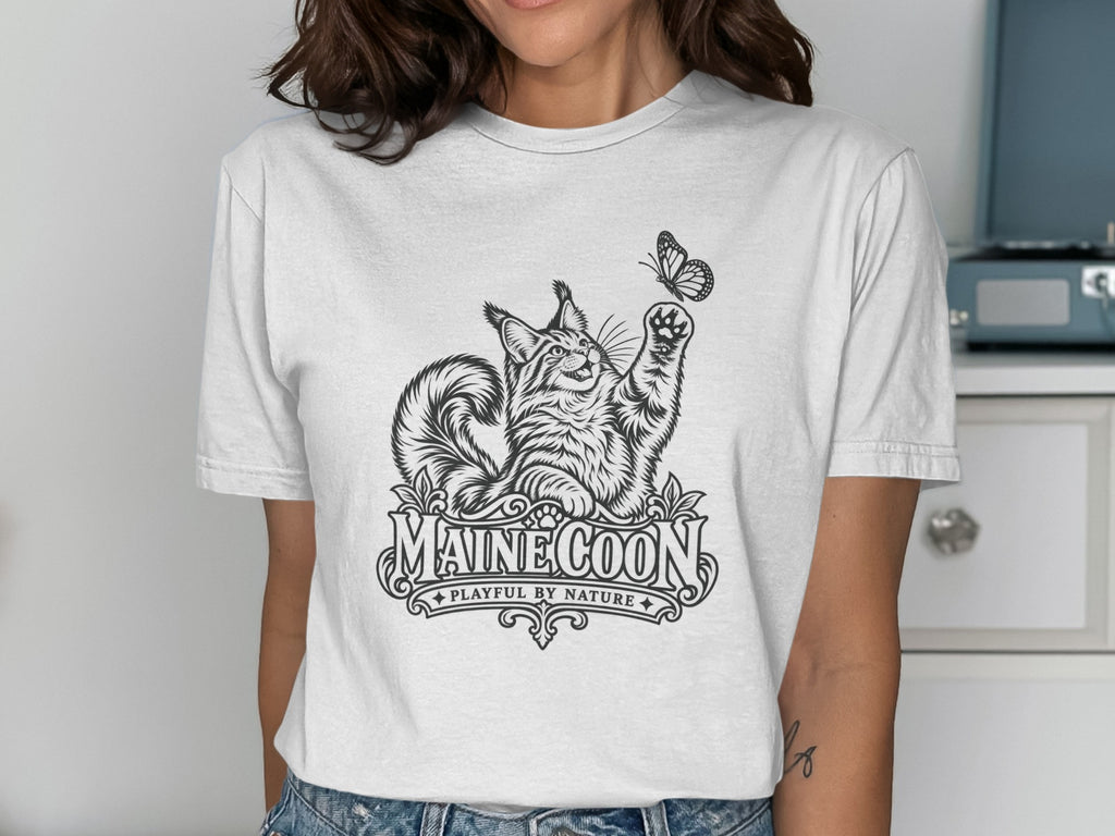 White t-shirt with Maine Coon cat and butterfly graphic and text.