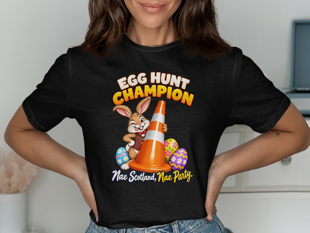 Black t-shirt with a cartoon bunny holding a traffic cone and text "EGG HUNT CHAMPION".