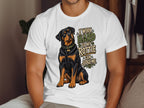 White t-shirt with Rottweiler dog graphic and text "I work hard so my rottie can judge me".