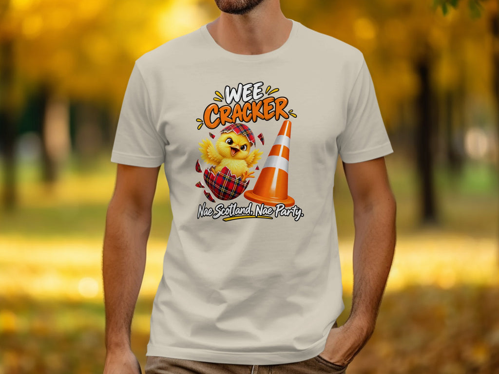 T-shirt graphic with chick hatching from plaid egg and text "Wee Cracker, Nae Scotland, Nae Party".