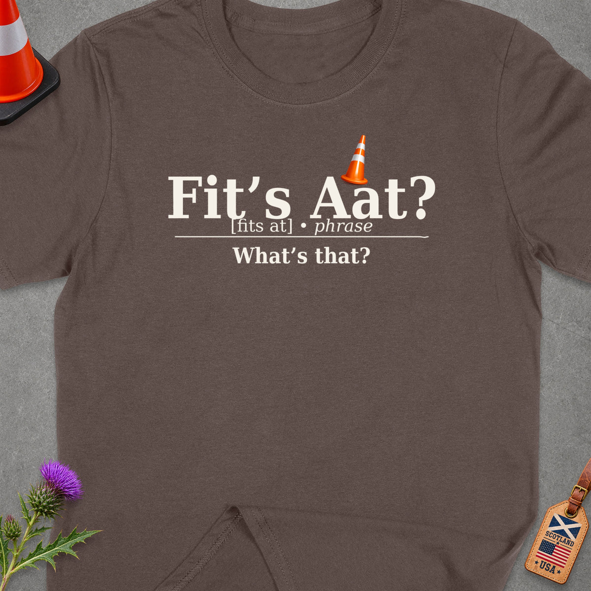 Brown t-shirt with "Fit's Aat? What's that?" text and Scotland USA tag.